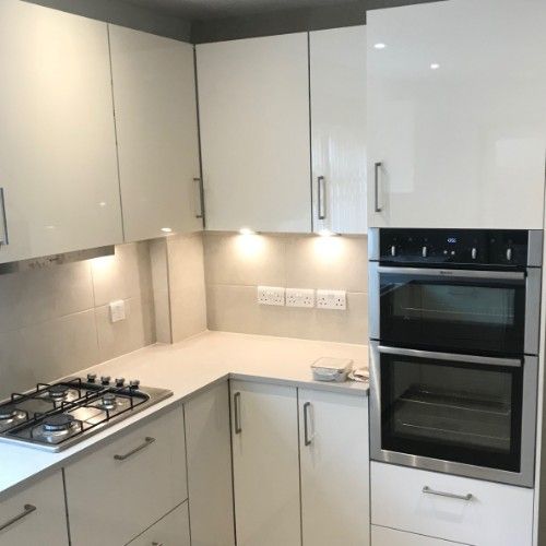 Stone Heat Ltd - Kitchens- white kitchen cupboards with lights - Loughton