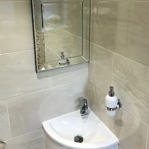 Stone Heat Ltd - Bathrooms - Cloak Room - Bathroom Installation - Mirror and Sink - Loughton 
